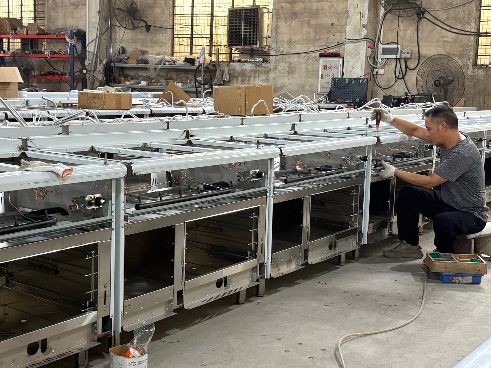 Commercial kitchen equipment assembly line in production