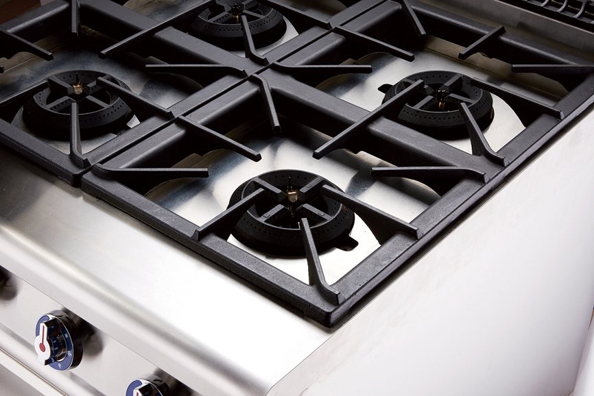 Close view of commercial gas range burner system